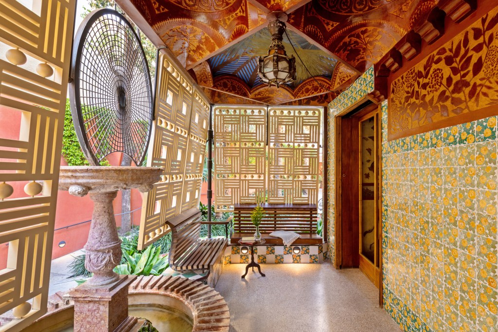 Exterior of Casa Vicens in Barcelona, a vibrant Gaudí-designed house featuring colorful tiles, Moorish-inspired patterns, and ornate ironwork