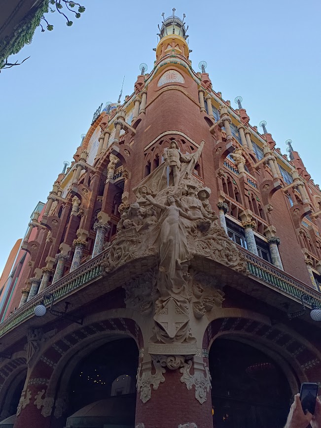 Exterior of the Palau de la Música Catalana in Barcelona, showcasing its ornate Modernisme architecture with colorful mosaics, stained glass, and intricate sculptures