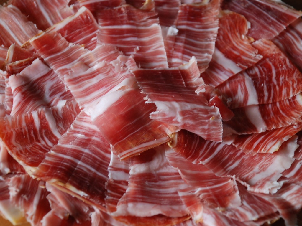Thin slices of Jamón Ibérico with Pata Negra and Bolleta, served with bread