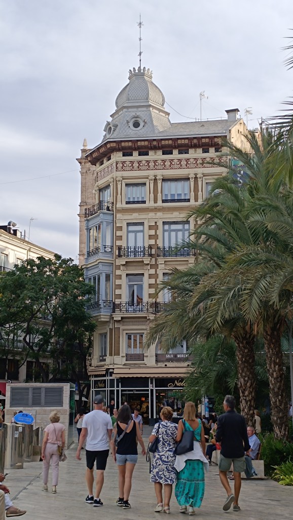 Valencia old town street with cobbled pavement and ornate building details