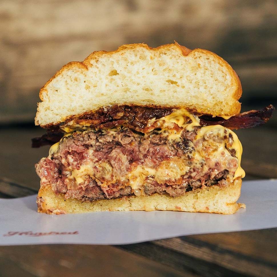 Close-up of a juicy burger at the famous Hundred Burger Place in Valencia