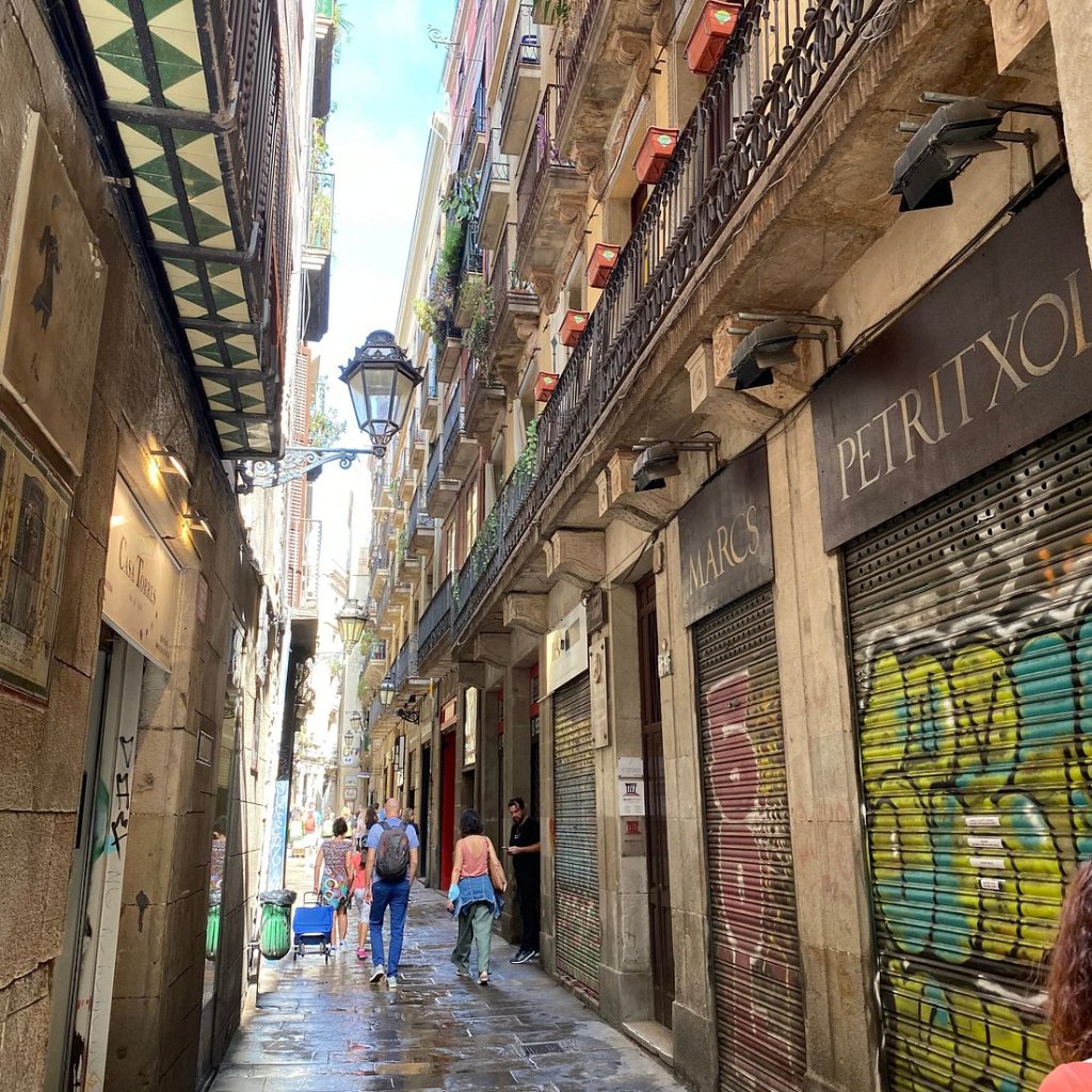 Carrer Petritxol narrow street in Barcelona Gothic Quarter, traditional xocolateries and art galleries