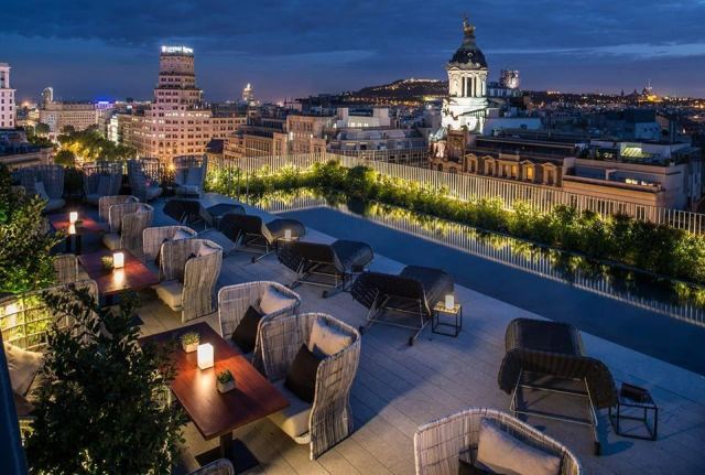 Hotel Pulitzer rooftop terrace with cocktails and city views in Barcelona