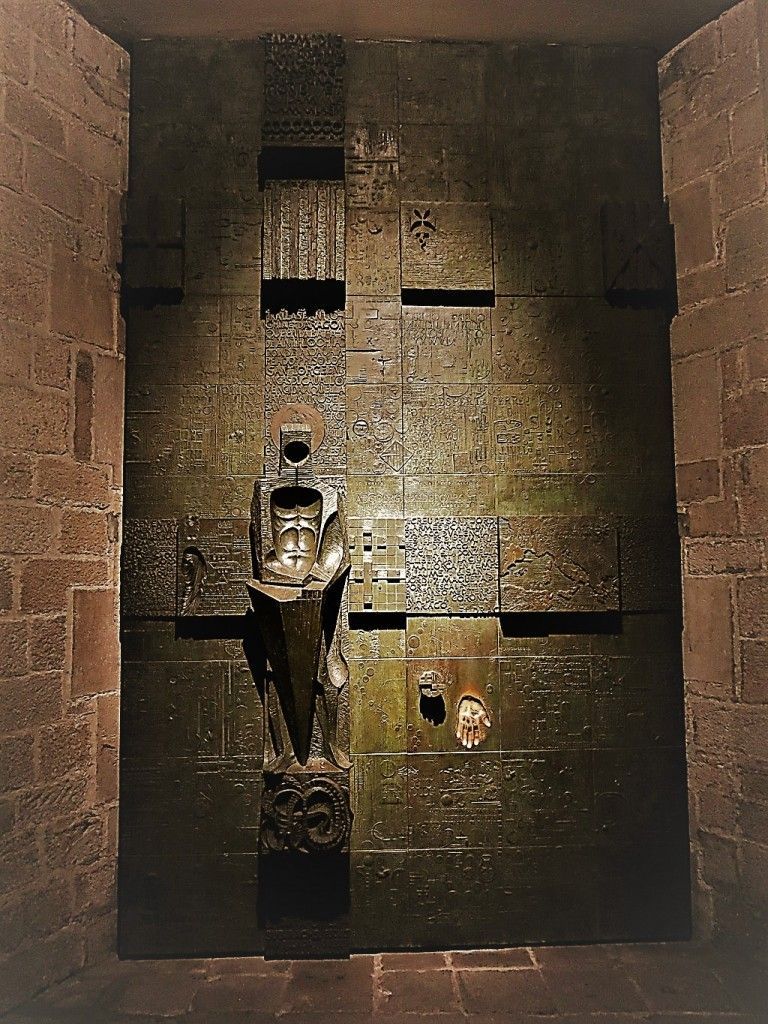 Porta de Sant Jordi bronze gate by Josep Maria Subirachs, 1975, modern art in Barcelona Gothic Quarter