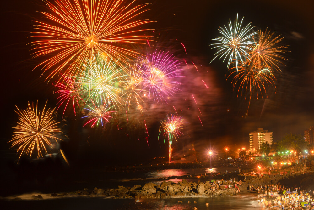 Fireworks lighting up the sky over the sea on the night of Sant Joan.