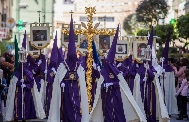 Participants wearing traditional robes during a Holy Week procession in Barcelona.