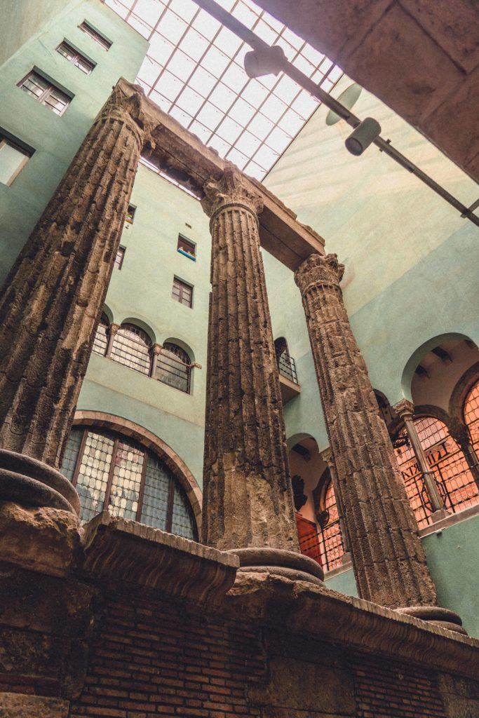 Roman Temple of Augustus columns hidden in Gothic Quarter courtyard, Barcelona ancient ruins