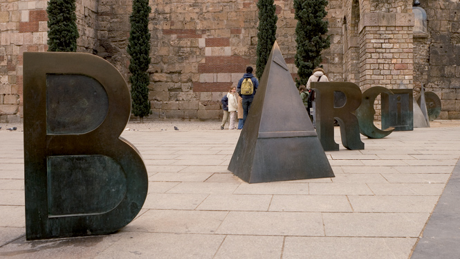 Metallic ‘Barcino’ letters in Barcelona’s Gothic Quarter, a modern art installation referencing the city’s ancient Roman name