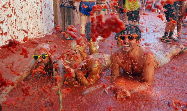Tomato-covered streets during La Tomatina festival in Spain